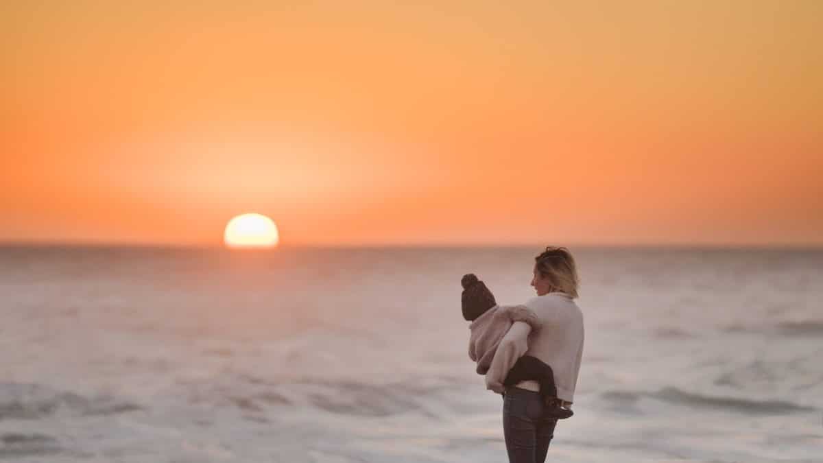 Mother and child looking at sunset understanding the laws of contravention of parenting orders