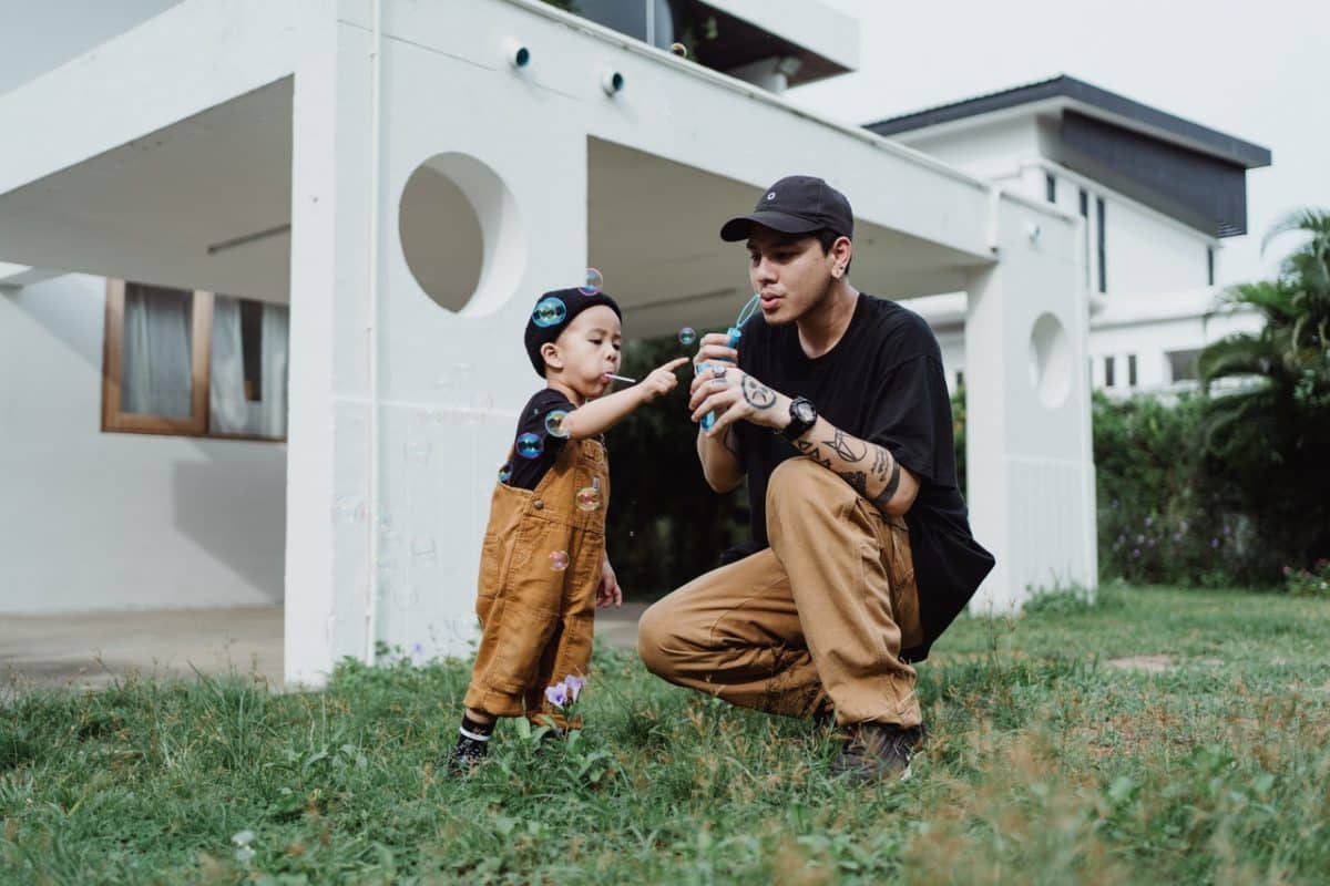 Dad and son blowing bubbles wondering what are consent orders