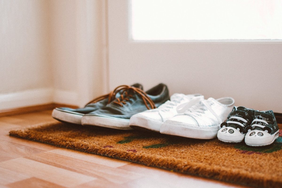 Family shoes at door symbolic of 70/30 property divorce settlement in Australia