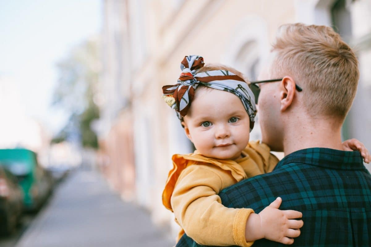 Father carrying baby as part of parenting agreements and arrangements