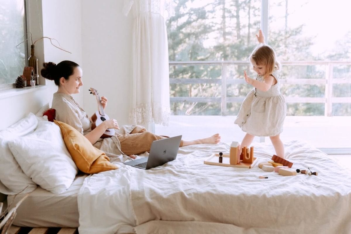 Mother on bed with daughter with equal shared parental responsibility