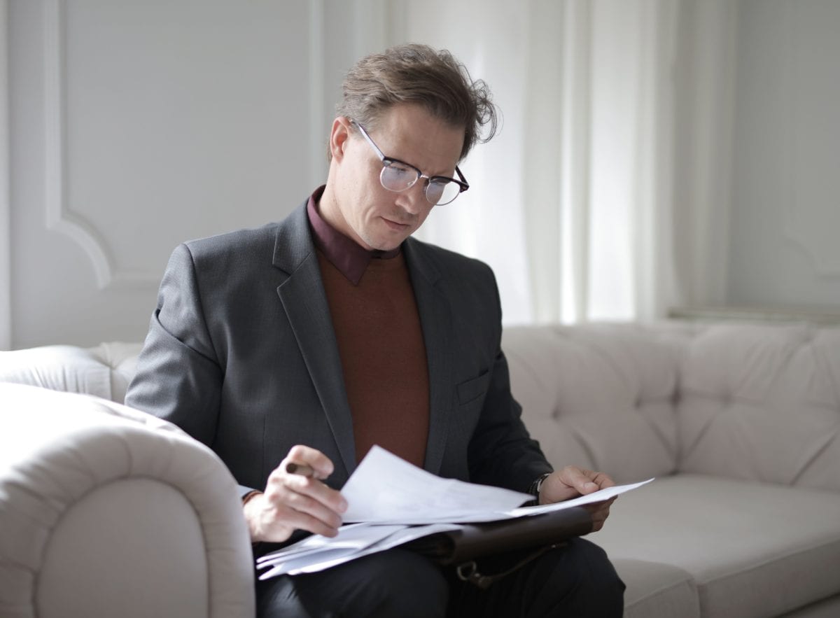 Lawyer in a suit drawing up a legal document on best practice of how to split your assets when divorcing